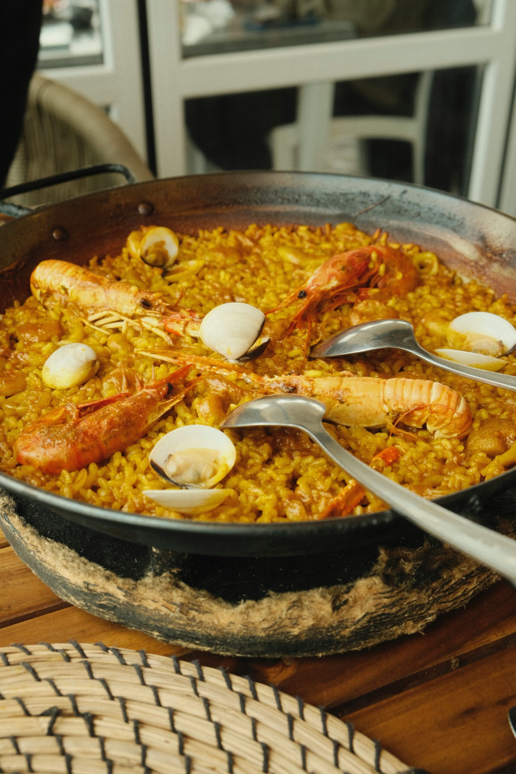 A pan of yellow seafood paella