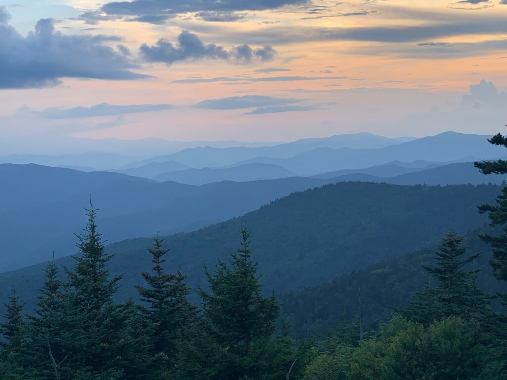 Several mountains in the blue light of the sunset