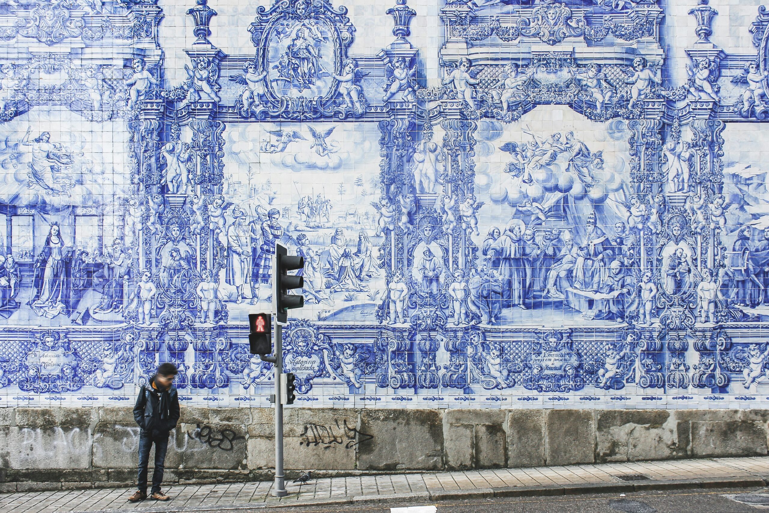 A wall with many sophisticated paintings in Porto Central Station
